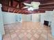 Bright and airy living room boasting tile floors, exposed wood beams, and a cozy fireplace at 611 19Th W Ave, Palmetto, FL 34221