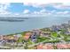 Aerial view of waterfront condo community near a bay with boat access and a view of the horizon at 6158 Palma Del Mar S Blvd # 504, St Petersburg, FL 33715