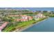 Aerial view of waterfront community featuring residential buildings, golf course, water features, and bay views at 6158 Palma Del Mar S Blvd # 504, St Petersburg, FL 33715