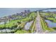 Expansive aerial view of a beautiful community featuring lush golf courses and waterfront properties on a sunny day at 6158 Palma Del Mar S Blvd # 504, St Petersburg, FL 33715