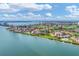 Aerial view of waterfront community featuring residential buildings, golf course, and expansive water views at 6158 Palma Del Mar S Blvd # 504, St Petersburg, FL 33715