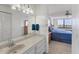 Bathroom view showing vanity and sink with a bedroom in the background at 6158 Palma Del Mar S Blvd # 504, St Petersburg, FL 33715
