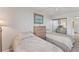 Bright bedroom showcasing two beds and a sliding-door closet at 6158 Palma Del Mar S Blvd # 504, St Petersburg, FL 33715