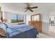 Bedroom featuring a ceiling fan, carpeted floors, and a large wooden dresser at 6158 Palma Del Mar S Blvd # 504, St Petersburg, FL 33715