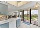 Open kitchen area with tile floors, leading into a living space and balcony with a view at 6158 Palma Del Mar S Blvd # 504, St Petersburg, FL 33715