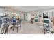 Spacious living area with mirrored walls, a glass dining table, and comfortable furniture at 6158 Palma Del Mar S Blvd # 504, St Petersburg, FL 33715