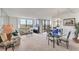 Bright living and dining area features neutral carpet and sliders to the lanai with water views at 6158 Palma Del Mar S Blvd # 504, St Petersburg, FL 33715