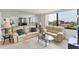 Cozy living room with comfortable seating and a serene view from the large window at 6158 Palma Del Mar S Blvd # 504, St Petersburg, FL 33715