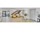Well-lit lobby with tiled floors, comfortable seating, stairs, elevator, and potted plants at 6158 Palma Del Mar S Blvd # 504, St Petersburg, FL 33715