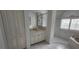 Bright bathroom featuring a shower, soaking tub and sink vanity with decorative hardware at 629 Sawgrass Bridge Rd, Venice, FL 34292