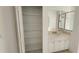 Bright bathroom featuring a storage closet, single sink with decorative hardware at 629 Sawgrass Bridge Rd, Venice, FL 34292