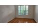 Bright bedroom with wood floors and plantation shutters letting in natural light at 629 Sawgrass Bridge Rd, Venice, FL 34292