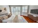 Bedroom with plantation shutters overlooking the pool area at 629 Sawgrass Bridge Rd, Venice, FL 34292