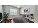 Modern bedroom with a large window and stylish decor at 629 Sawgrass Bridge Rd, Venice, FL 34292