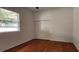 Bedroom features hardwood floors and a double door closet for plenty of storage at 629 Sawgrass Bridge Rd, Venice, FL 34292