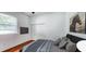 Bedroom with hardwood floors, a double door closet, a tv, and decor at 629 Sawgrass Bridge Rd, Venice, FL 34292