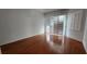 Bedroom features hardwood floors and plantation shutters at 629 Sawgrass Bridge Rd, Venice, FL 34292