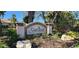 Attractive Sawgrass community sign surrounded by lush landscaping, plants and decorative rocks at 629 Sawgrass Bridge Rd, Venice, FL 34292