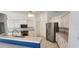 Kitchen with stainless steel appliances, island and white cabinetry at 629 Sawgrass Bridge Rd, Venice, FL 34292