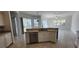 An eat-in kitchen with stainless steel appliances and views of the pool at 629 Sawgrass Bridge Rd, Venice, FL 34292