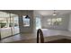 An indoor living space with tile flooring and a view of the pool area at 629 Sawgrass Bridge Rd, Venice, FL 34292