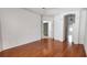 Spacious living room with hardwood floors and arched doorways at 629 Sawgrass Bridge Rd, Venice, FL 34292