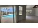 Bright living room featuring view of the pool at 629 Sawgrass Bridge Rd, Venice, FL 34292