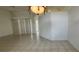 Spacious living room with tile floors and overhead light fixture at 629 Sawgrass Bridge Rd, Venice, FL 34292