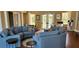Bright community center sitting area with comfortable couches and decorative pillows at 629 Sawgrass Bridge Rd, Venice, FL 34292