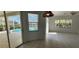 Bright living room with large window and view of the pool at 629 Sawgrass Bridge Rd, Venice, FL 34292