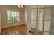 Office space with wood floors, glass french doors, and plantation shutters at 629 Sawgrass Bridge Rd, Venice, FL 34292
