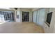View of patio with access to the pool area through sliding glass doors at 629 Sawgrass Bridge Rd, Venice, FL 34292