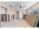 Bedroom with a ceiling fan, window, and closet, ready for renovation and customization at 713 Saint Judes S Dr # 1, Longboat Key, FL 34228