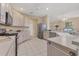 Bright kitchen with stainless steel appliances, a gas range, and ample counter space at 7415 Loblolly Bay Trl, Lakewood Ranch, FL 34202