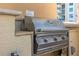 Built-in stainless steel grill with adjacent countertop, perfect for outdoor cooking and entertaining at 800 N Tamiami Trl # 810, Sarasota, FL 34236