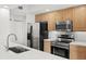 Well-equipped kitchen features stainless steel appliances and sleek countertops at 800 N Tamiami Trl # 810, Sarasota, FL 34236