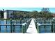 Dock with access to boat slips and stunning views of the condominium complex at 8635 Midnight Pass Rd # 206C, Sarasota, FL 34242