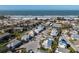 Aerial view of a stunning beach community and surrounding neighborhood near the sandy shore at 9 Palm Harbor Dr, Holmes Beach, FL 34217
