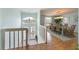 Bright foyer leads to dining area, showcasing hardwood floors and a large window at 9 Palm Harbor Dr, Holmes Beach, FL 34217