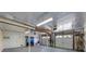 Spacious garage with ample storage, lighting, and multiple access points at 9 Palm Harbor Dr, Holmes Beach, FL 34217