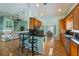 Charming kitchen with wood cabinetry, granite countertops, and stainless steel appliances at 9 Palm Harbor Dr, Holmes Beach, FL 34217