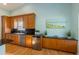Spacious kitchen featuring stainless steel appliances and wooden cabinetry at 9 Palm Harbor Dr, Holmes Beach, FL 34217