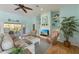 Cozy living area featuring a fireplace, built-in shelves, and comfortable seating at 9 Palm Harbor Dr, Holmes Beach, FL 34217