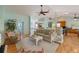 Open-concept living room featuring hardwood floors and comfortable seating at 9 Palm Harbor Dr, Holmes Beach, FL 34217