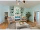 Bright and comfortable living space features built in shelves and coastal decor at 9 Palm Harbor Dr, Holmes Beach, FL 34217