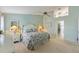 Comfortable main bedroom with neutral tones, ceiling fan, and ensuite bathroom at 9 Palm Harbor Dr, Holmes Beach, FL 34217