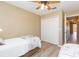 Bedroom featuring two twin beds and wood-look flooring at 903 Pinellas Bayway S # 102, St Petersburg, FL 33715