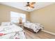 Bedroom with two twin beds and wood-look flooring at 903 Pinellas Bayway S # 102, St Petersburg, FL 33715