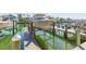 Private boat dock with boat lift showcasing waterfront living and recreational opportunities at 903 Pinellas Bayway S # 102, St Petersburg, FL 33715