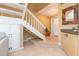 Inviting foyer with staircase, tiled floors, and a charming decor, perfect for a warm welcome at 903 Pinellas Bayway S # 102, St Petersburg, FL 33715